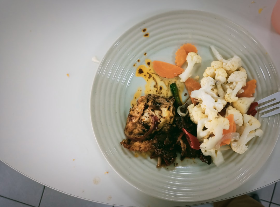 Organized meal prep containers with fresh vegetables and grilled chicken